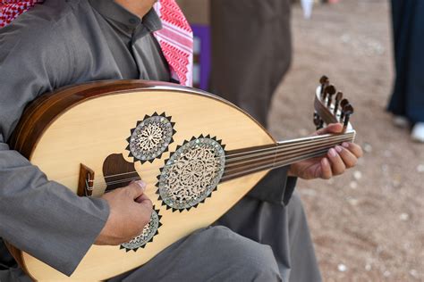 The oud pronounced as "ud" precedes the European lute, a plucked stringed musical instrument with a pear-shaped body, rounded back made of wood strips and a bent back pegbox. . Middle eastern string instruments